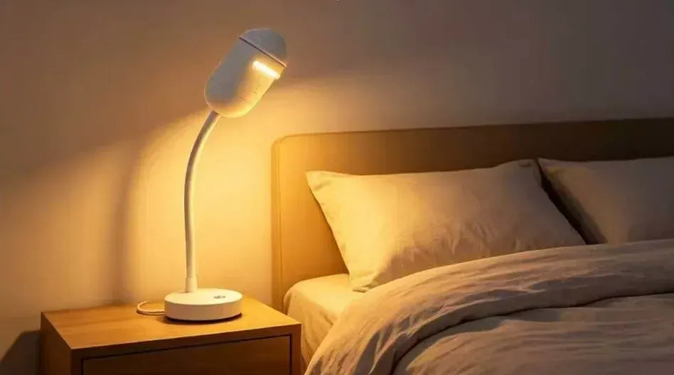 Night light mode: soft warm glow beside a bed (supplier image)
